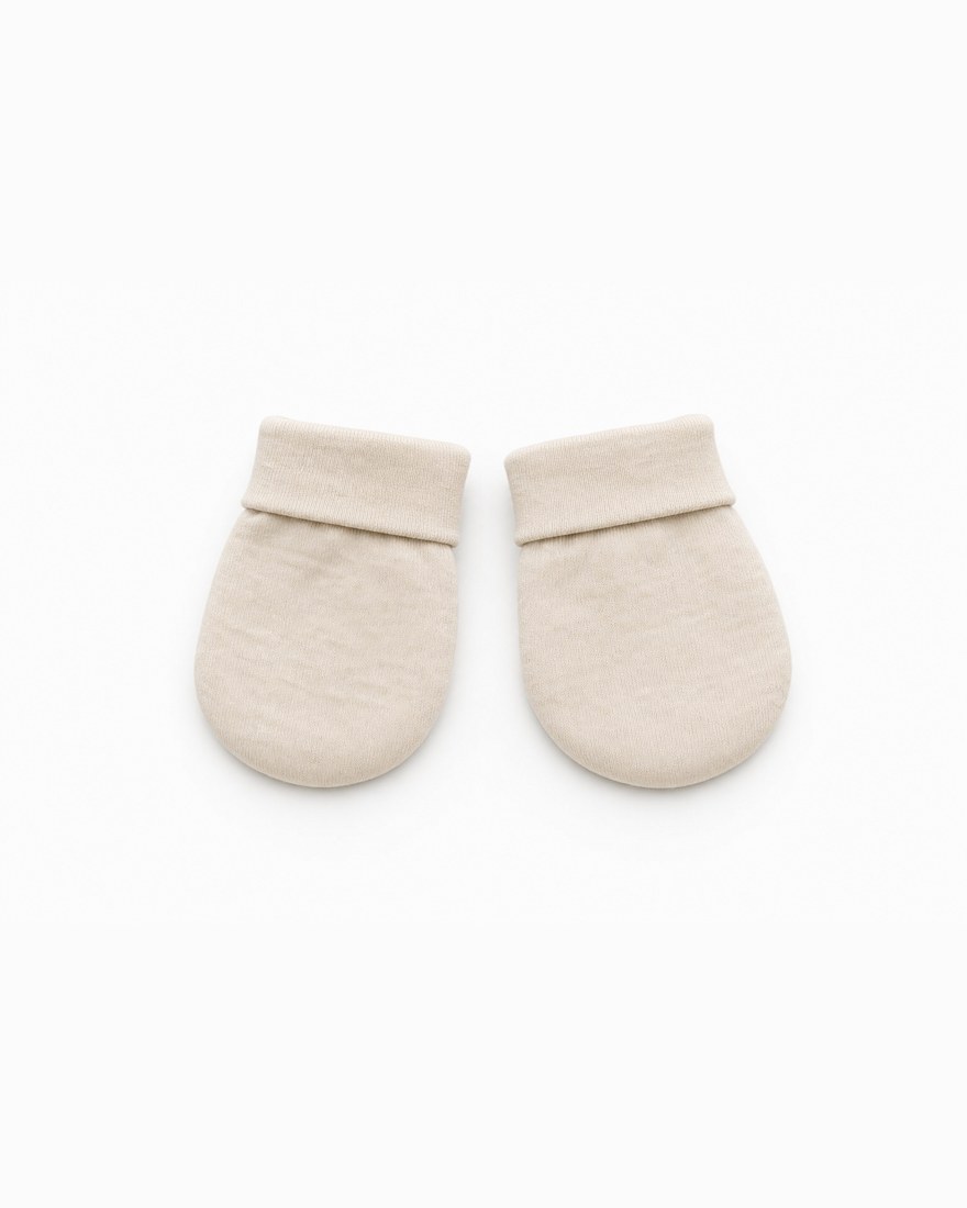 Pair of ivory bamboo newborn scratch mittens laid flat